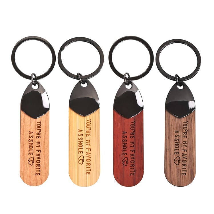 Four wood engraved keychain with "You're my favorite asshole" engraved. Wholesale wooden keychain supplier.