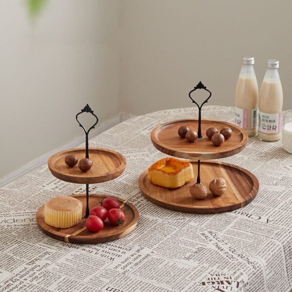 Two-tiered wooden serving tray with nuts and pastries. Wholesale double-layer nut tray.
