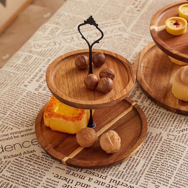 Double-layer wooden tray with nuts and pastries. Wholesale supplier of tiered trays.