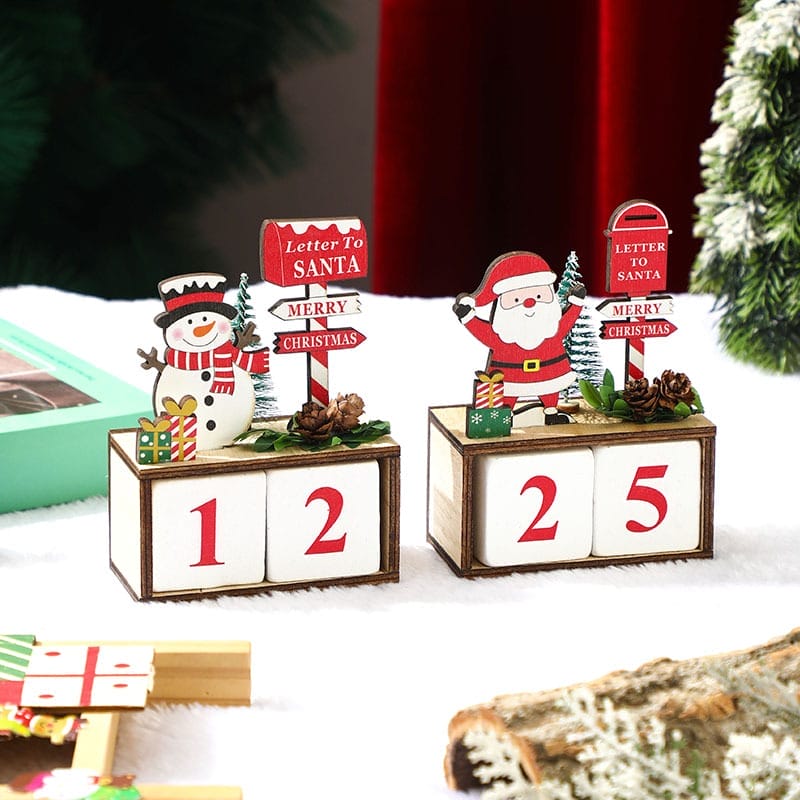Wooden Christmas advent calendar countdown blocks showing 12 and 25. Features snowman and Santa decorations.