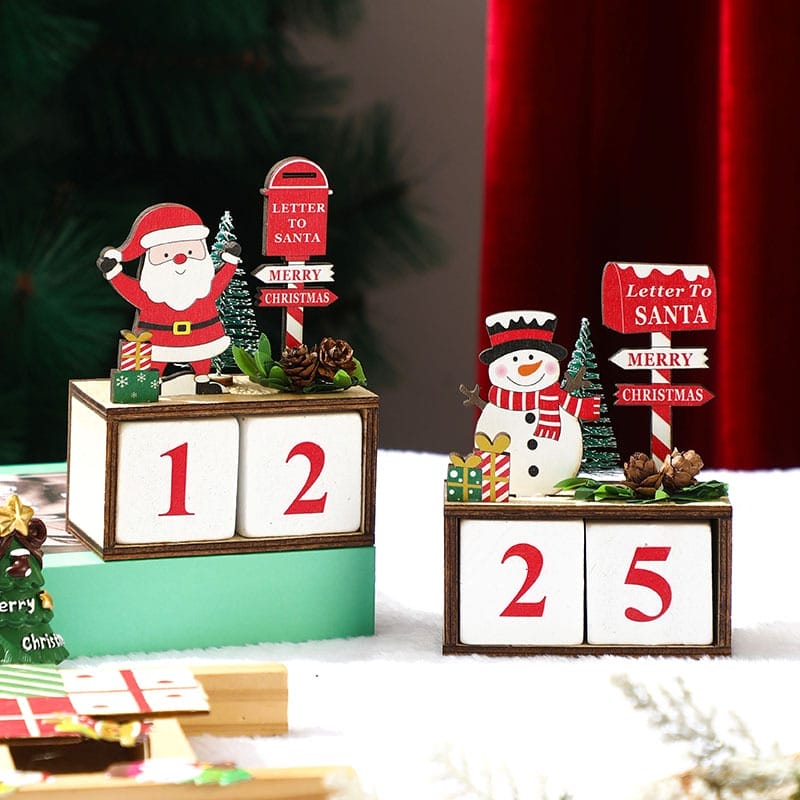 Wooden Christmas advent calendar showing 12 and 25. Santa and snowman decorations.