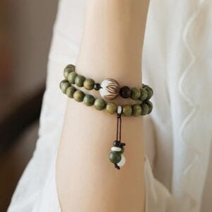 Custom Wooden Bead Bracelet: Elegant sandalwood mala beads, green wooden bead bracelets with decorative accents.