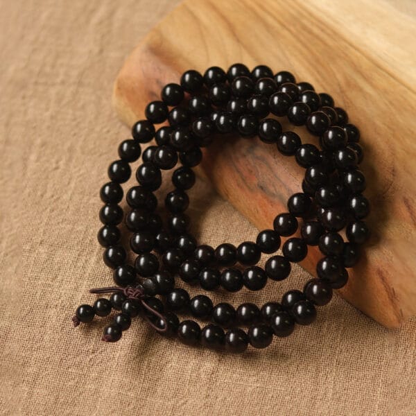 Black wooden bead necklace, wholesale supplier for distributors and retailers.