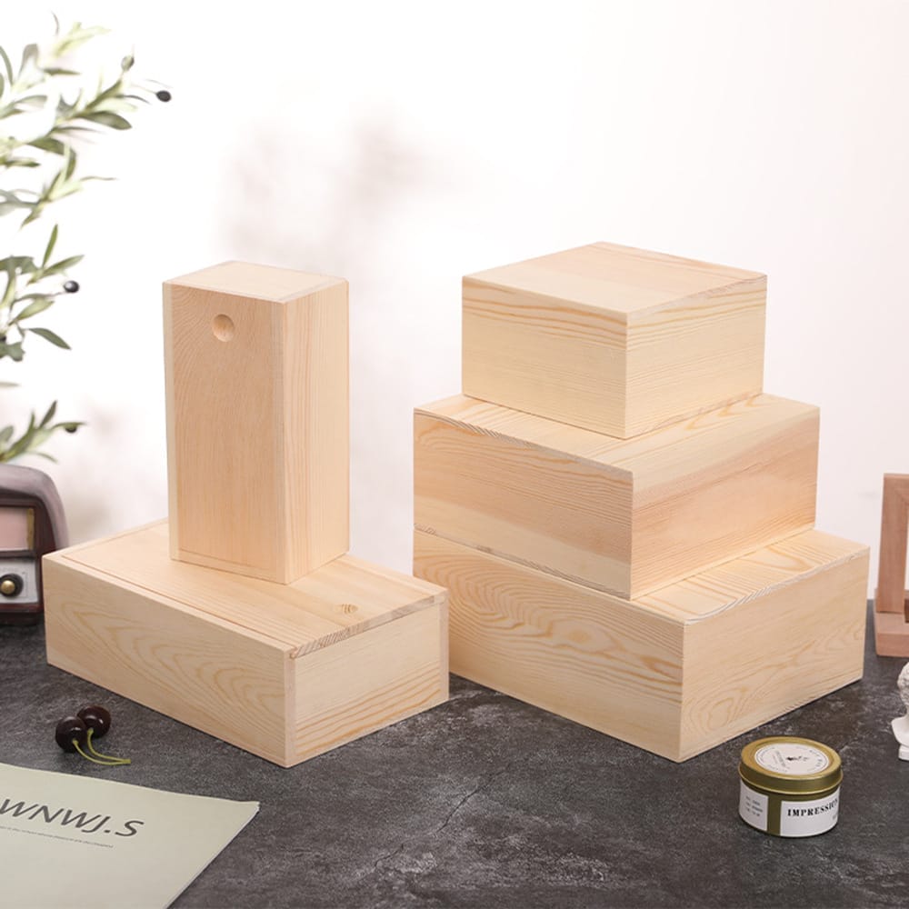 Stacked unfinished pine wood boxes of varying sizes, perfect for DIY crafts or storage.