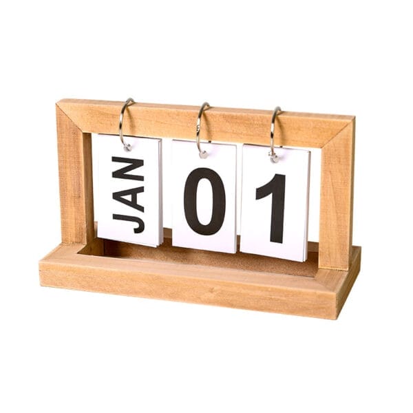 Wooden perpetual calendar showing January 1st. Eco-friendly flip calendar design.