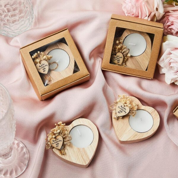Heart-shaped wooden candle holders with "Thank You for Celebrating with Us!" message. Wholesale wedding favors.