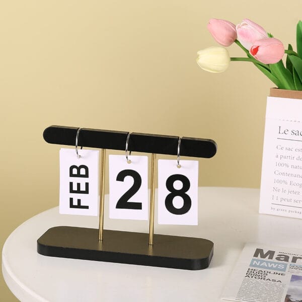 Black wooden desktop calendar displaying February 28th. Wholesale home decor.