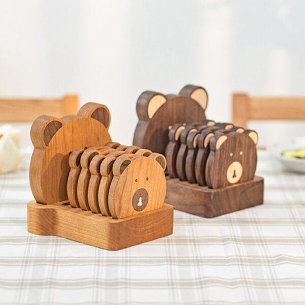 Cute Bear-Shaped Wooden Coaster Set of 8, light & dark brown, stacked on matching wooden holders. Perfect for home decor.
