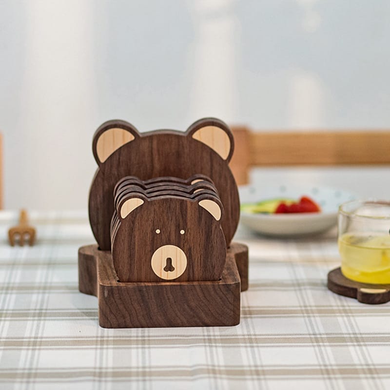 Cute bear-shaped walnut wooden coaster set. Perfect for adding charm to your home decor.