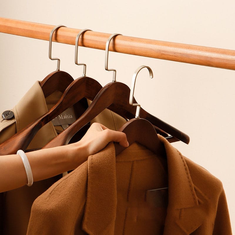 High-quality wooden coat hangers, perfect for displaying and storing your coats. Customizable wooden hangers available.