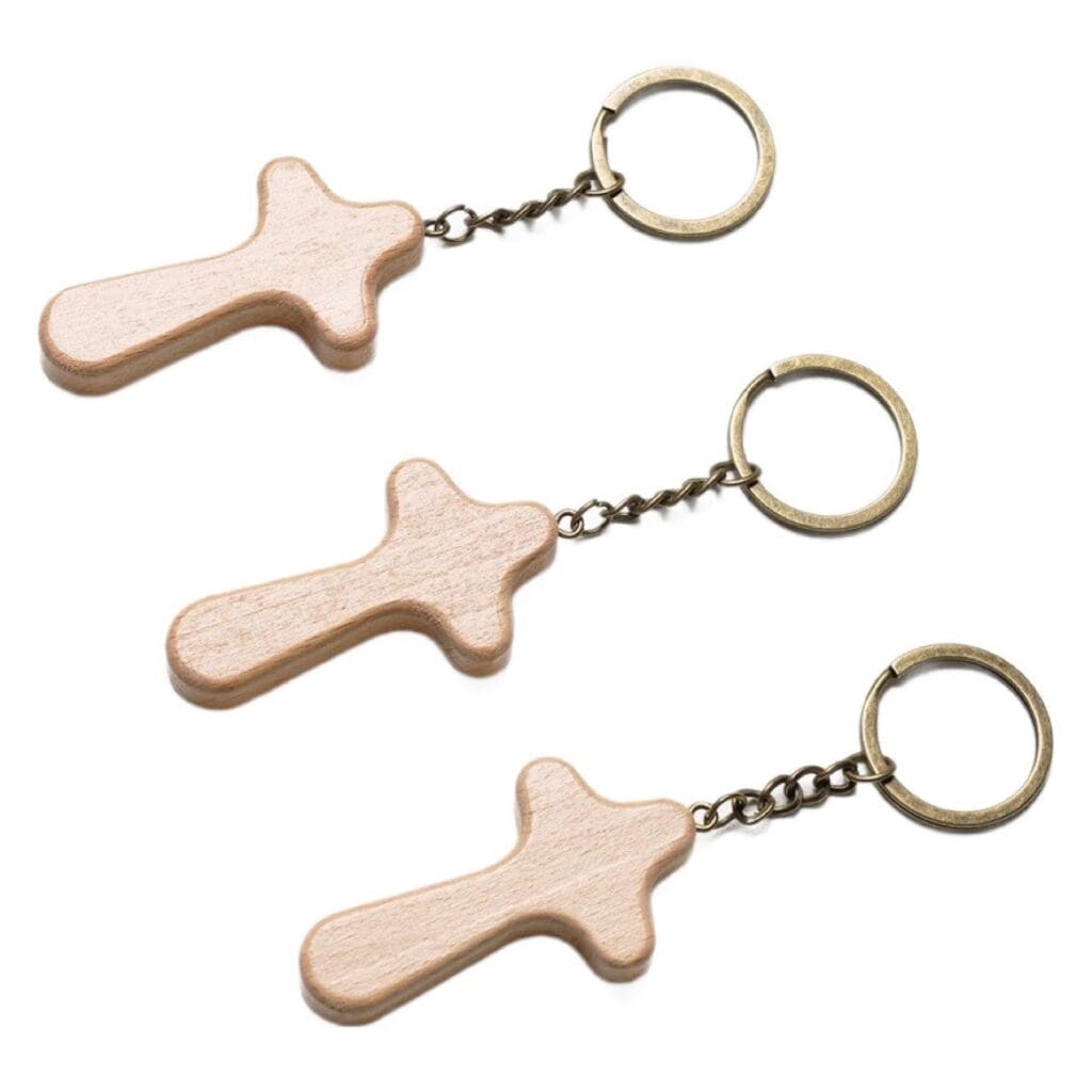 Three wooden cross keychain, custom-made by a wooden cross keychain manufacturer.