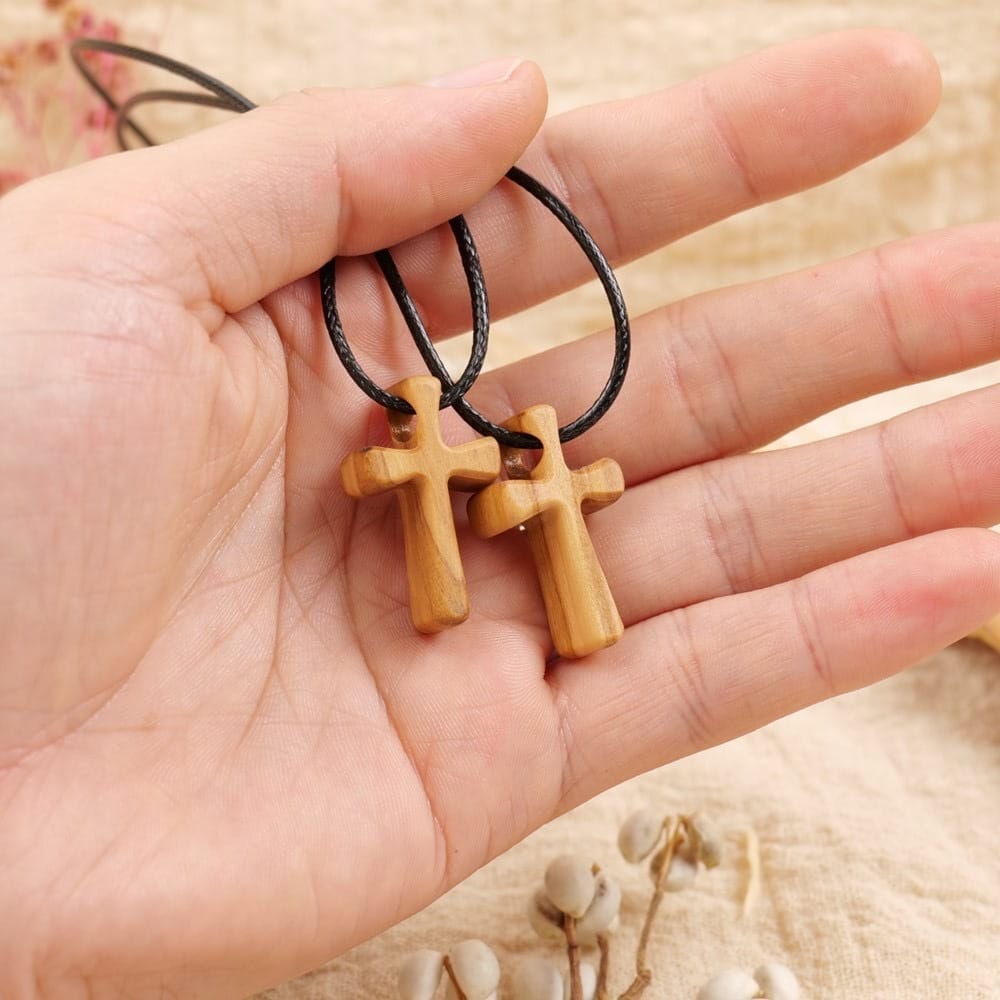 Pair of olive wood cross necklaces with black cords. Religious jewelry, perfect gift.