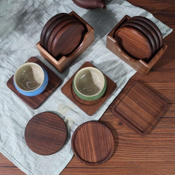 Set of round and square wooden cup coasters, some stacked in holders. Wholesale wooden cup coasters.