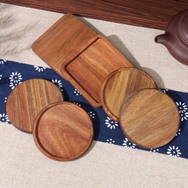 Set of round and square wooden coasters. Wholesale bamboo heat insulation coasters.