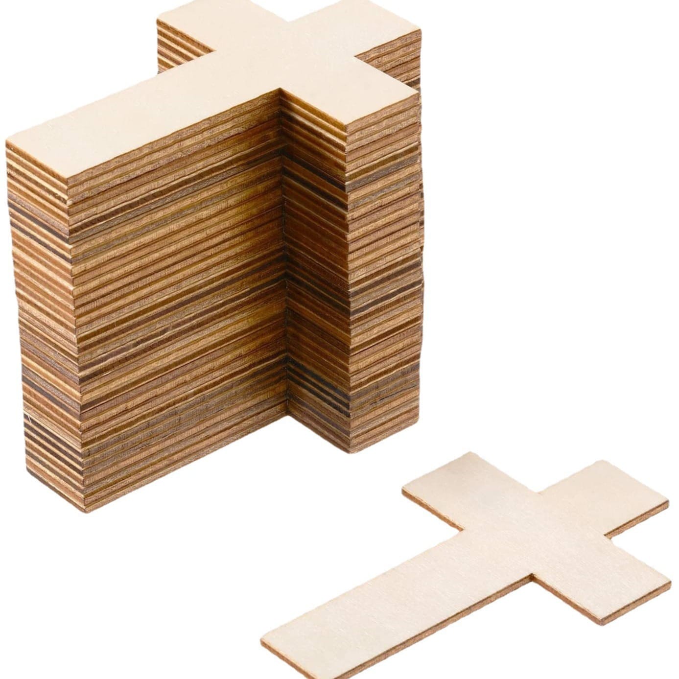 Stack of unfinished wooden cross cutouts; eco-friendly craft supplies.