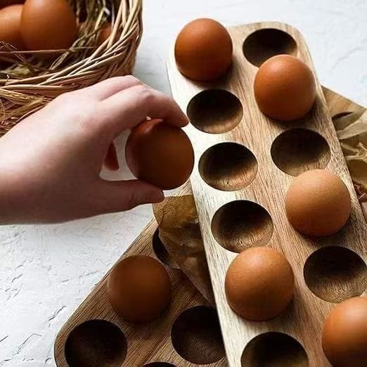 Eco-friendly wooden egg holder tray for kitchen storage. Holds multiple eggs securely.