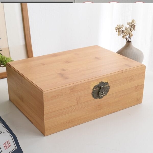 Handcrafted bamboo wooden gift box with ornate metal clasp; perfect for storage or gifting.
