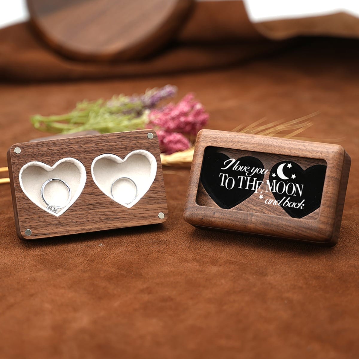Wooden Ring Boxes: Two handcrafted walnut ring boxes; one with double heart-shaped compartments, the other with "I love you to the moon and back" engraving. Perfect for wedding or engagement.