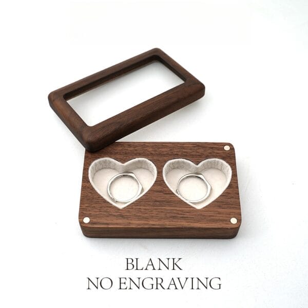 Walnut wood double ring box with heart-shaped compartments for wedding or engagement rings. Rustic style, perfect for proposals.