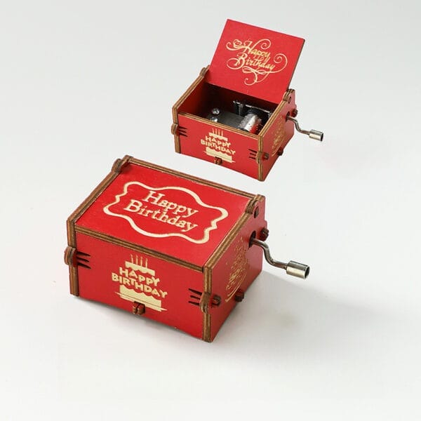 Vintage Hand-Crank Wooden Music Box: Red wooden music box with "Happy Birthday" engraving, showing the hand-crank mechanism.