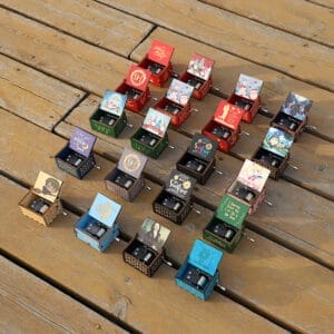 Vintage Hand-Crank Wooden Music Boxes: Collection of custom engraved wooden music boxes with various designs. Wholesale available. Custom Wooden Music Box.