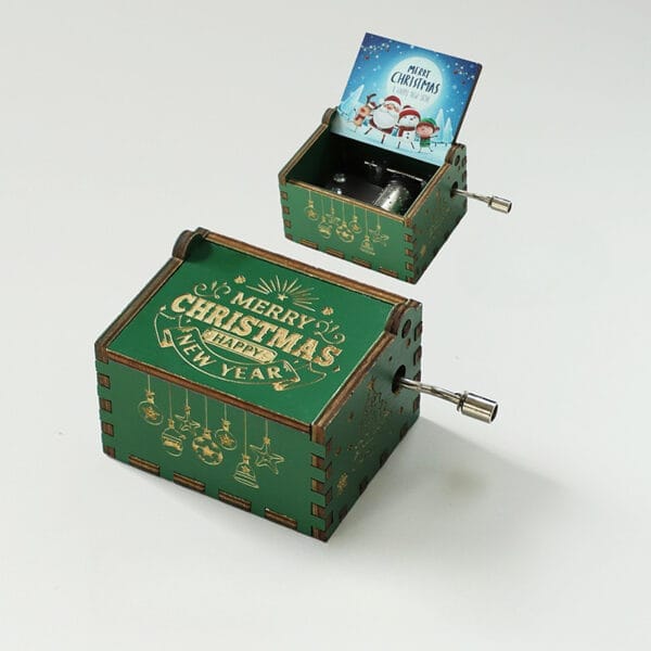 Vintage Hand-Crank Wooden Music Box: Green Christmas music box with "Merry Christmas Happy New Year" engraving. Features a custom engraved design and hand-crank mechanism.