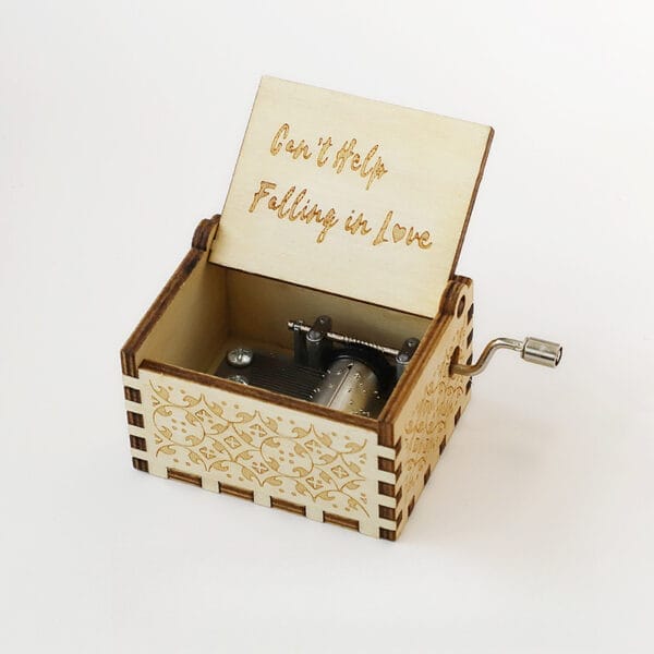Vintage Hand-Crank Wooden Music Box with "Can't Help Falling in Love" engraving. Features intricate design and a custom engraved lid.