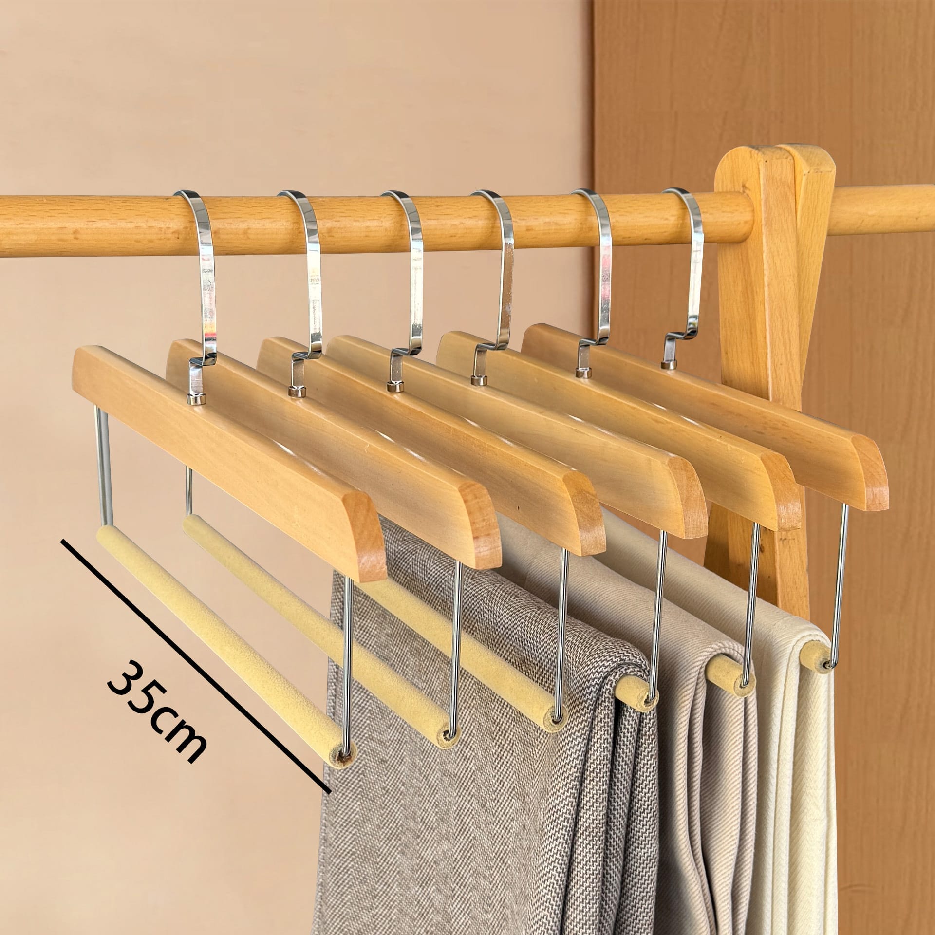 Wooden pants hangers with trouser bar; ideal for closet organization and clothing storage.
