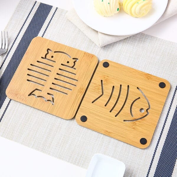 Bamboo Coasters: Set of two custom wooden coasters featuring unique fish and skeleton designs. Wholesale available.