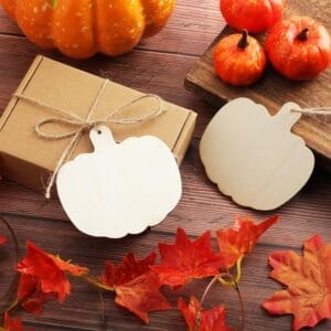 Wooden pumpkin cutouts: Blank, rustic Halloween decorations perfect for DIY crafts.