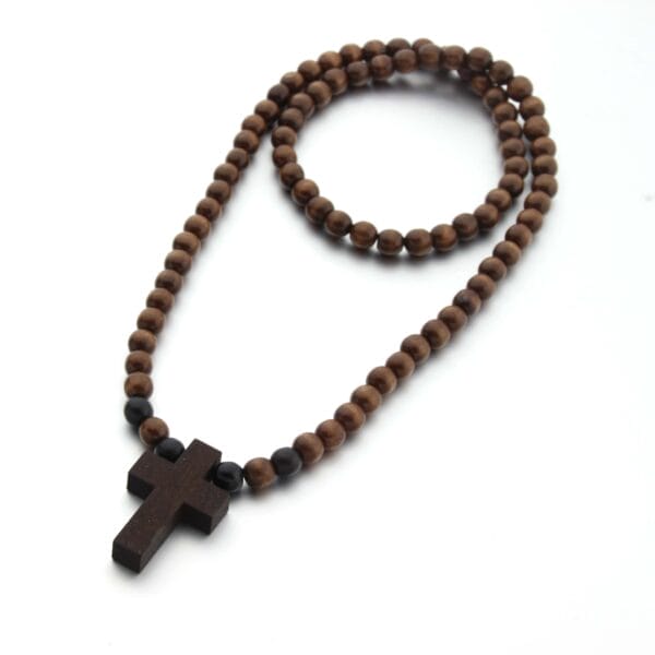 Brown wooden bead necklace with a dark wood cross pendant. Wooden rosary beads.