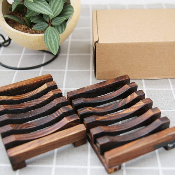 Eco-friendly wooden soap dish: Set of two dark brown wooden soap holders, perfect for bathroom organization.
