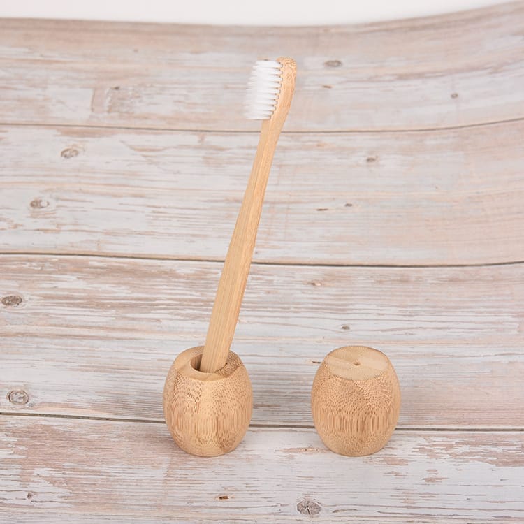 Bamboo toothbrush & holder set: Eco-friendly wooden stand & sustainable bamboo toothbrush, ideal for hotels.