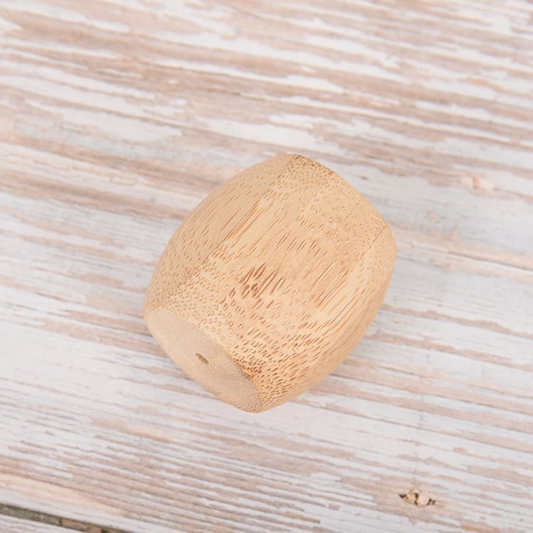 Bamboo toothbrush holder: Eco-friendly wooden stand for hotel bathrooms. Durable bamboo construction.