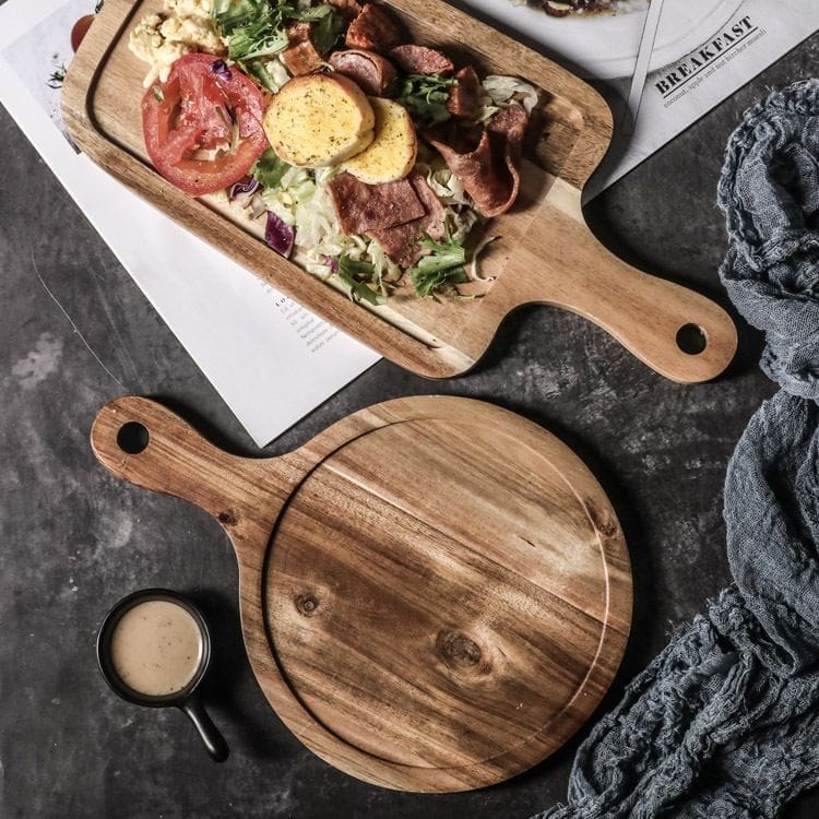 Two rustic wooden serving trays with handles, perfect for eco-friendly pizza serving. Wholesale available.