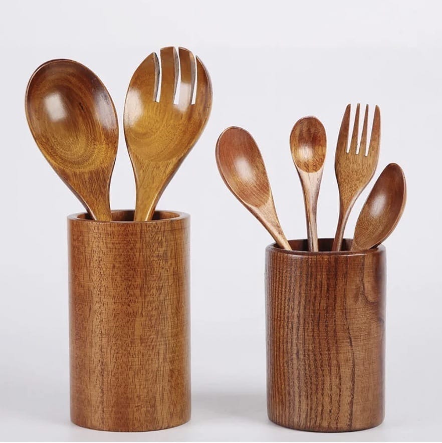Wooden utensil holders with assorted wooden spoons and forks. Perfect kitchen organizer for wooden kitchenware.