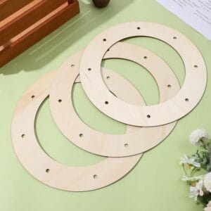 Three unfinished wooden wreath rings, perfect for DIY crafts. These wooden wreath blanks are ideal for creating unique wreaths.