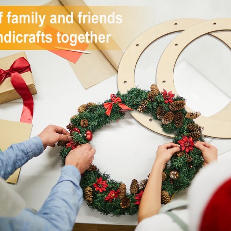 People crafting a Christmas wreath using wholesale wooden wreath rings.
