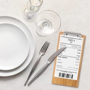 Restaurant table setting with receipt showing $7.25 total.