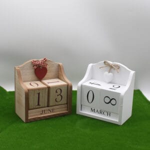Wooden perpetual calendar blocks showing June 13th and March 8th.