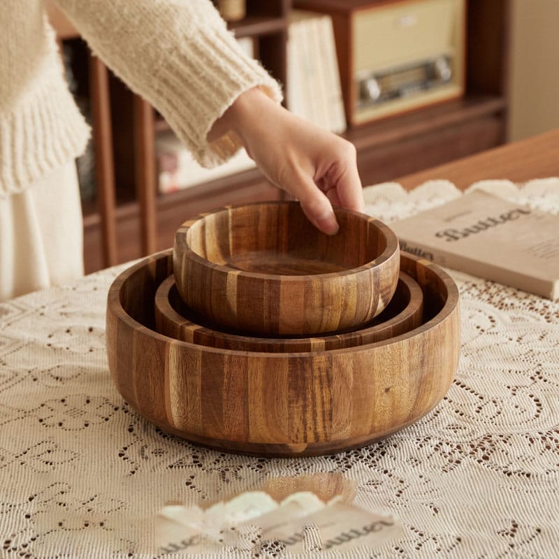 acacia wood bowls wholesale: Set of three nested salad bowls, handcrafted from acacia wood, showcasing natural wood grain. Wholesale options available.