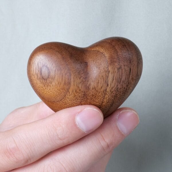 Hand-carved solid black walnut wooden heart. Custom-made.