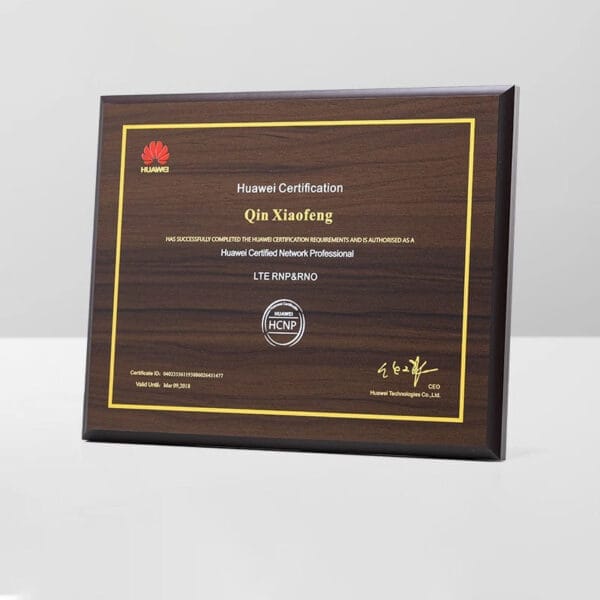 Custom engraved plaque: Dark brown wooden award plaque recognizing Qin Xiaofeng's Huawei Certified Network Professional certification. Wholesale options available.