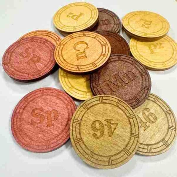 Custom Wooden Coins: Set of laser-cut bamboo coins, UV printed with various chemical symbols and numbers. Ideal for educational games or collectibles.