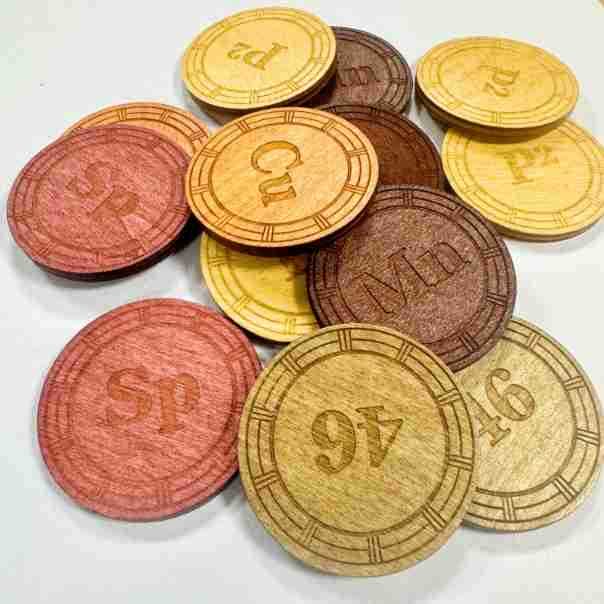 Custom Wooden Coins: Set of laser-cut bamboo coins, UV printed with various chemical symbols and numbers. Ideal for educational games or collectibles.