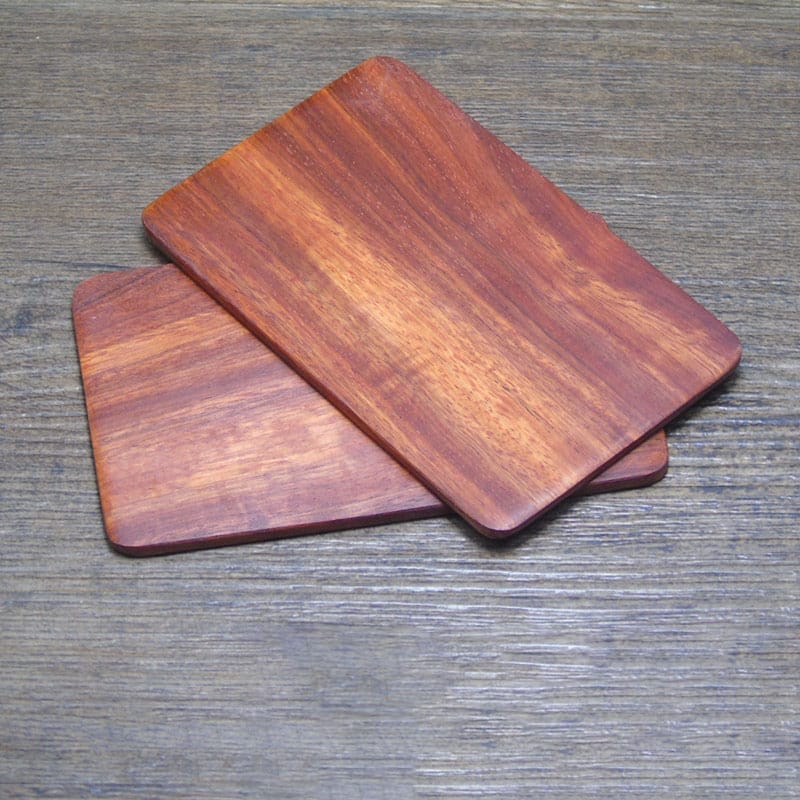 Custom Laser Cut Wooden Business Card Holders: Set of two rectangular wooden coasters, perfect for business cards or display.