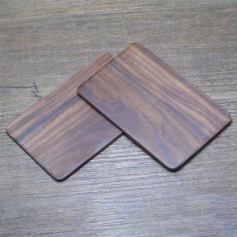 Custom Laser Cut Wooden Business Card Holders: Wholesale pack of two elegant dark brown wooden coasters. Perfect for business cards or display.