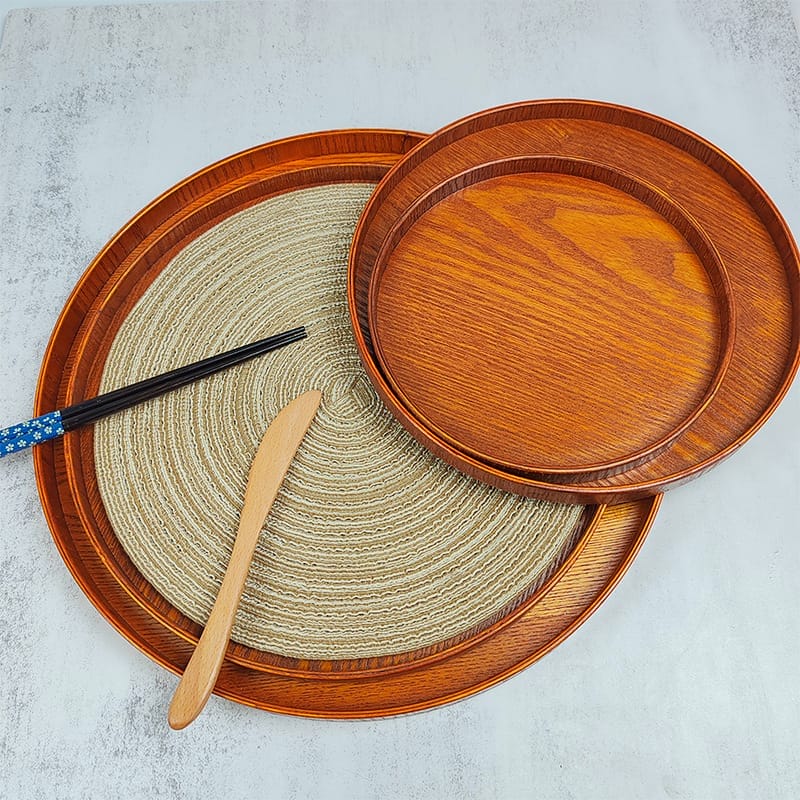 Custom Round Wooden Tray: Set of three nested round wooden serving trays, perfect for fruit, snacks, or entertaining.