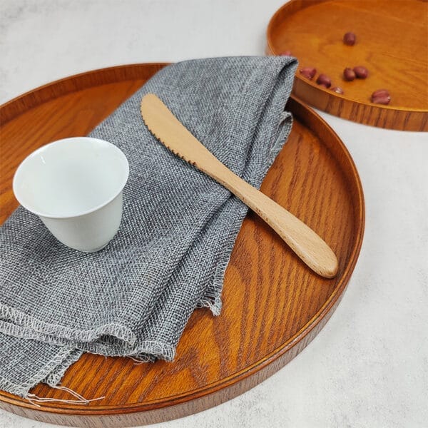 Custom Round Wooden Tray: Rustic wood serving tray, perfect for fruit, snacks, or tea. Features a round shape and natural wood grain.