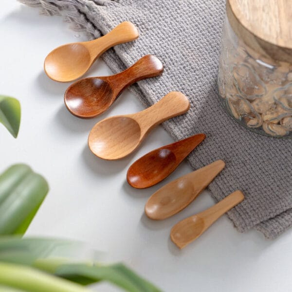 wholesale mini wooden spoons, various sizes and shades of brown, perfect for spices, honey, or other small servings.
